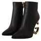 Dolce & Gabbana Elegant Black Leather Ankle Boots with Gold Detailing