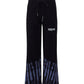 Comme Des Fuckdown Abstract Print Palazzo Pants with Bold Logo