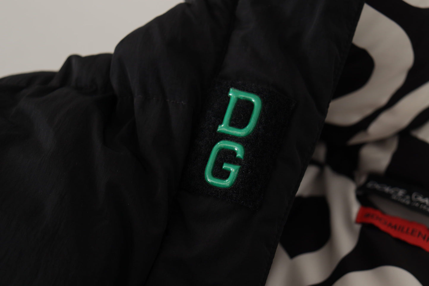 Dolce & Gabbana Elegant Black Puffer Jacket with Knit Logo Details