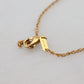 Dolce & Gabbana Elegant Gold Tone Charm Necklace with Cross Pendant